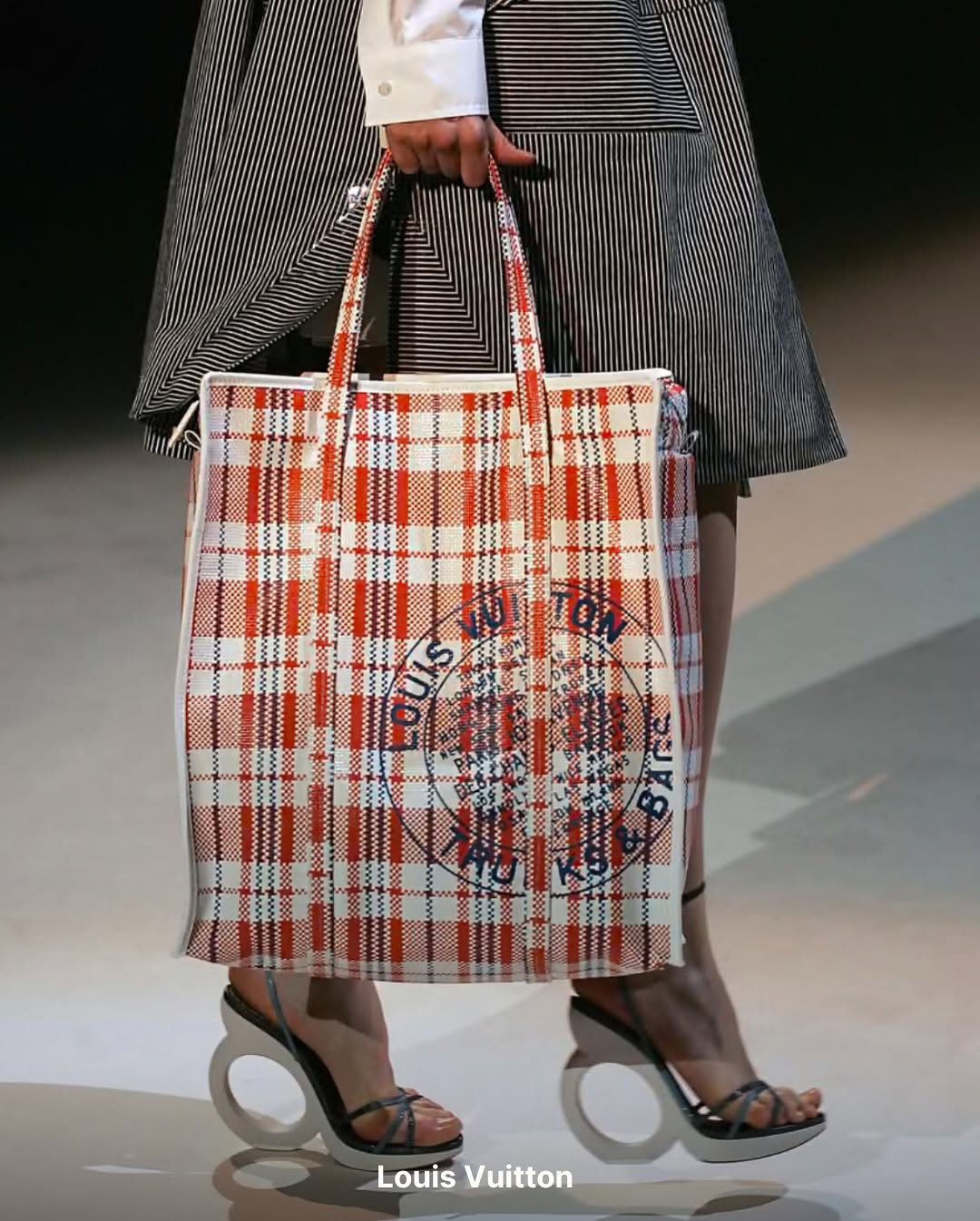 model carrying a tote ghana must go bag